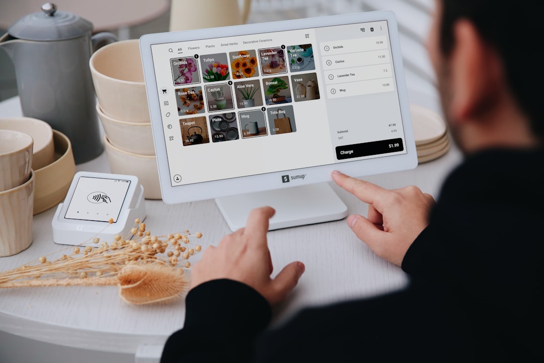person using a tablet at a stores checkout multichannel sales marketplace orders inventory sync