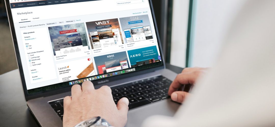 person using macbook pro ecommerce website laptop shopping cart