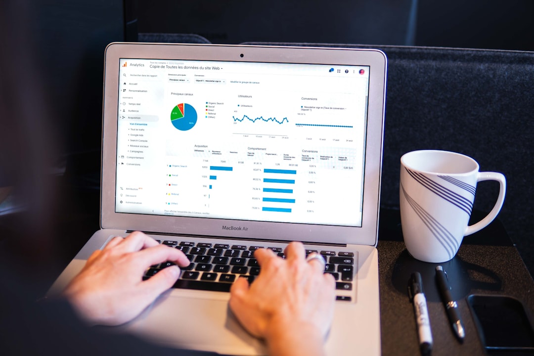 person using macbook pro on black table competitive analysis answer engine results seo reporting