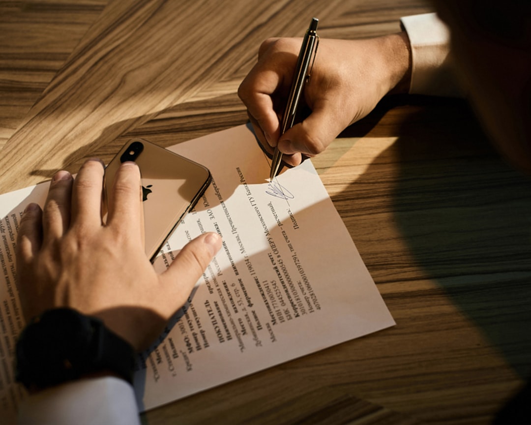 person writing on white paper service proposal written quote business agreement