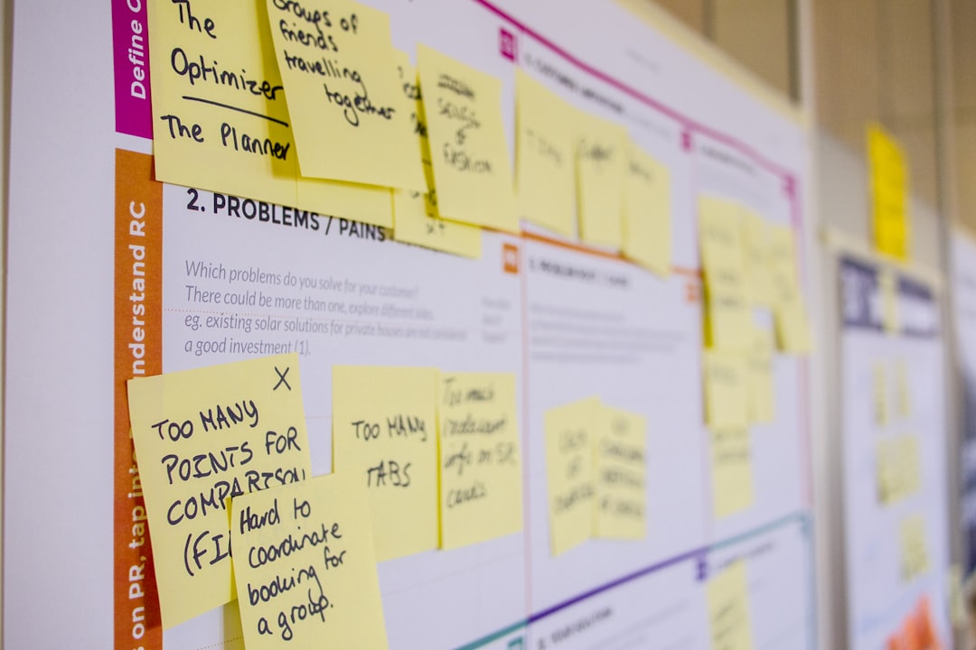 printed sticky notes glued on board project management shared documents team productivity