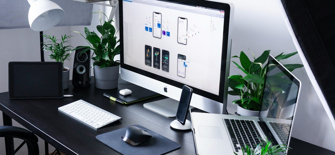 silver imac beside macbook pro apple devices task list clean workspace