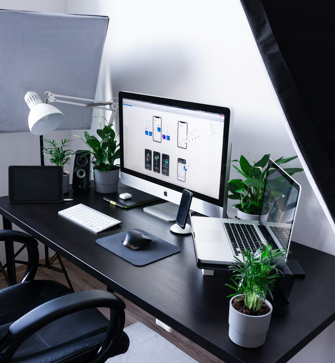 silver imac beside macbook pro apple devices task list clean workspace