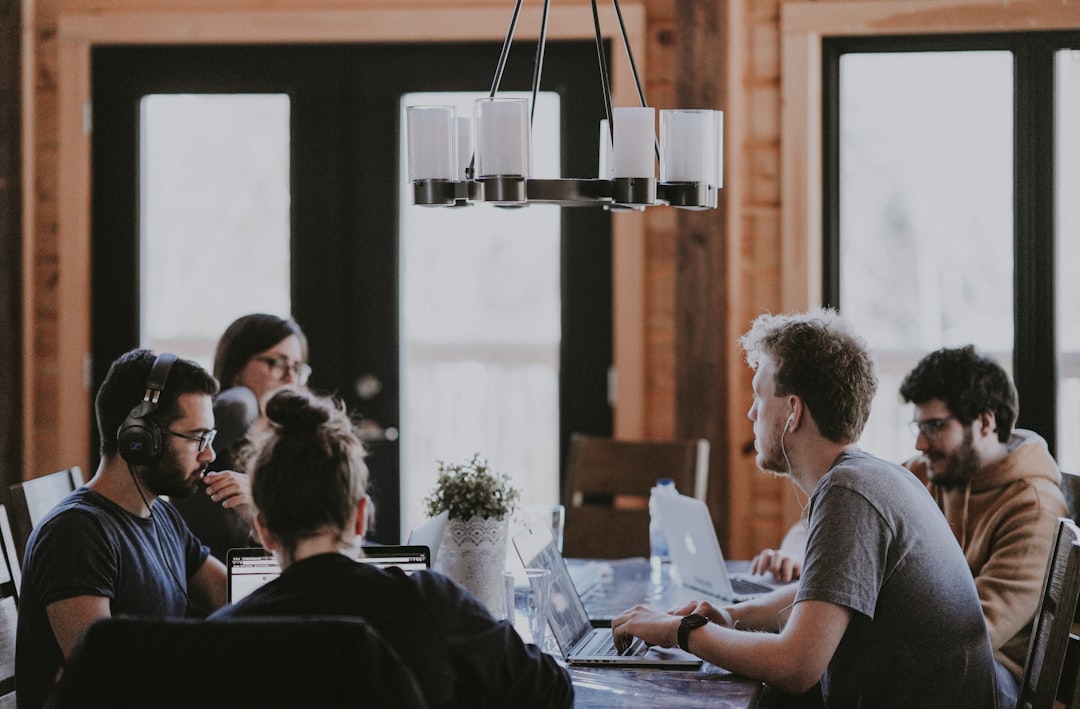 sittin people beside table inside room customer retention meeting support strategy professional discussion 1