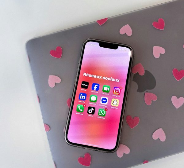The Benefits of Adding a BigCommerce Chatbot to Your Store 9 smartphone displaying social media apps on laptop live chat widget online store customer