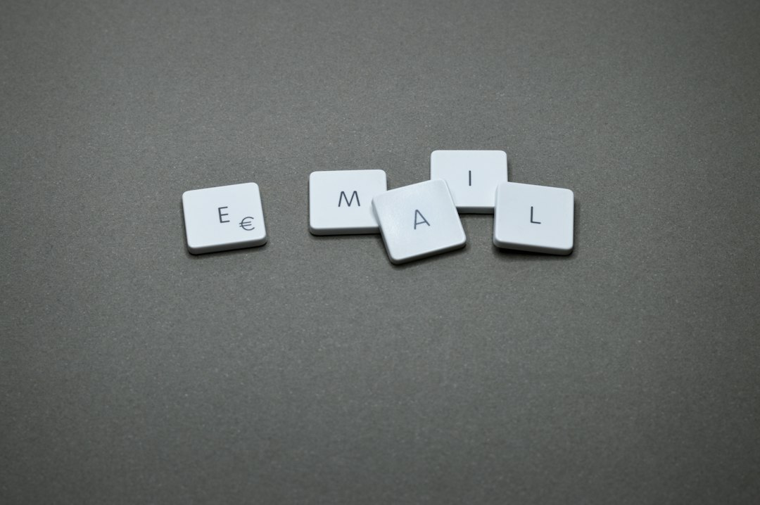 the word email is spelled out with letter tiles email checklist professional farewell workplace etiquette