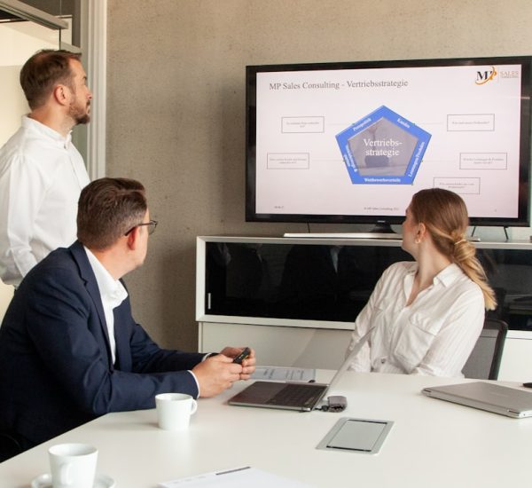 Customer Data Integration Explained: How Businesses Connect Customer Information Across Marketing and Sales Systems 8 three people in a meeting room looking at a presentation logistics team crm dashboard freight sales 2
