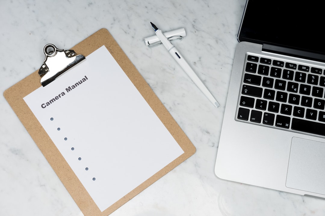 white paper on silver laptop computer human resources employee records verification request