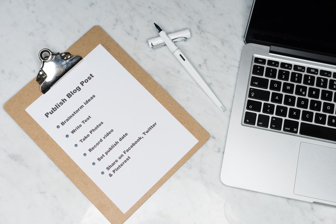 white printer paper beside silver macbook troubleshooting guide common errors support checklist 1