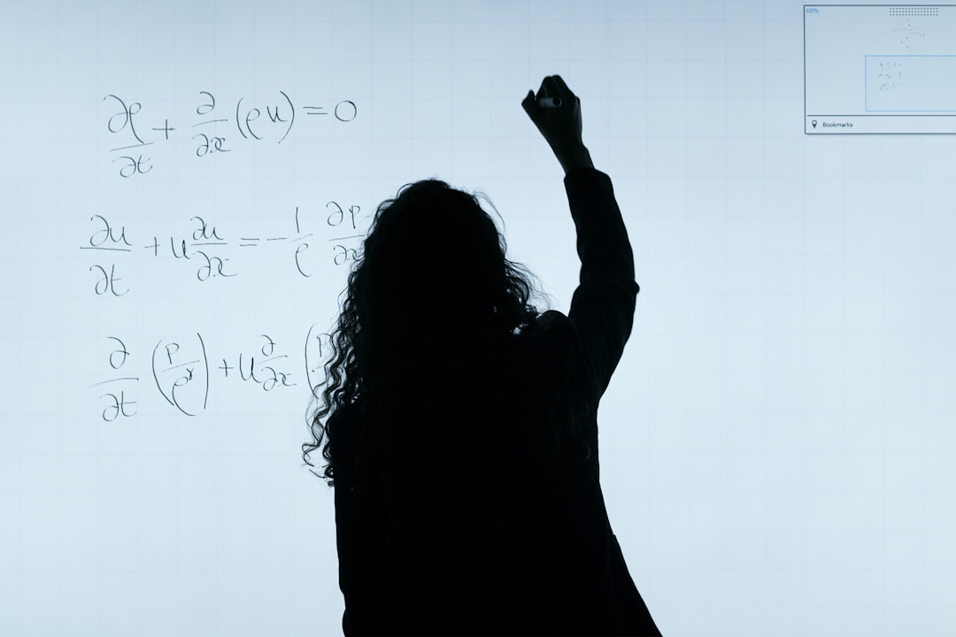 woman in black long sleeve shirt distributive property algebra steps teacher board