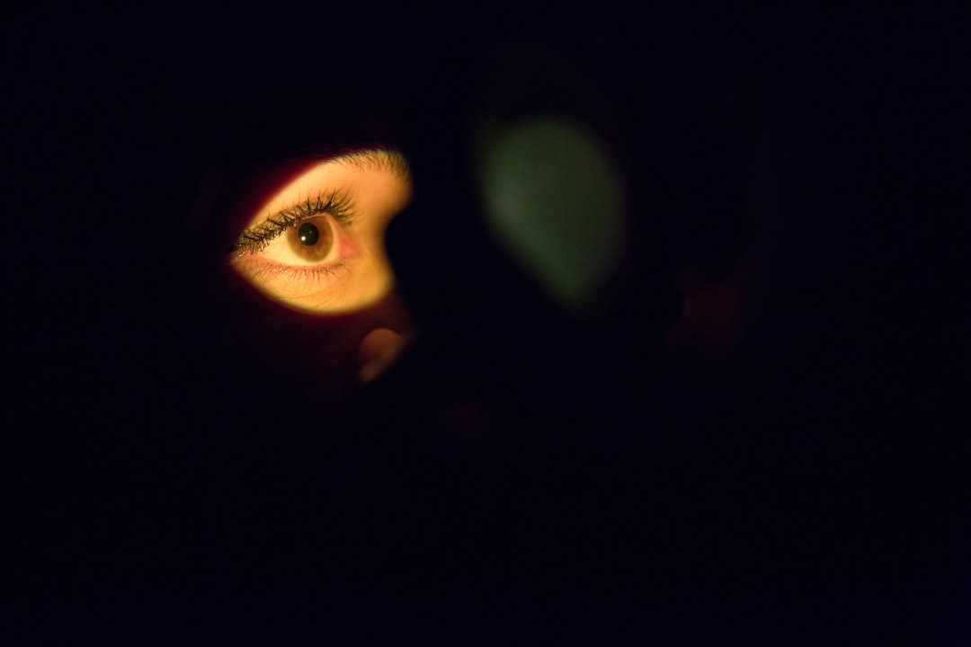 womans face with green eyes night vision camera infrared leds dark room
