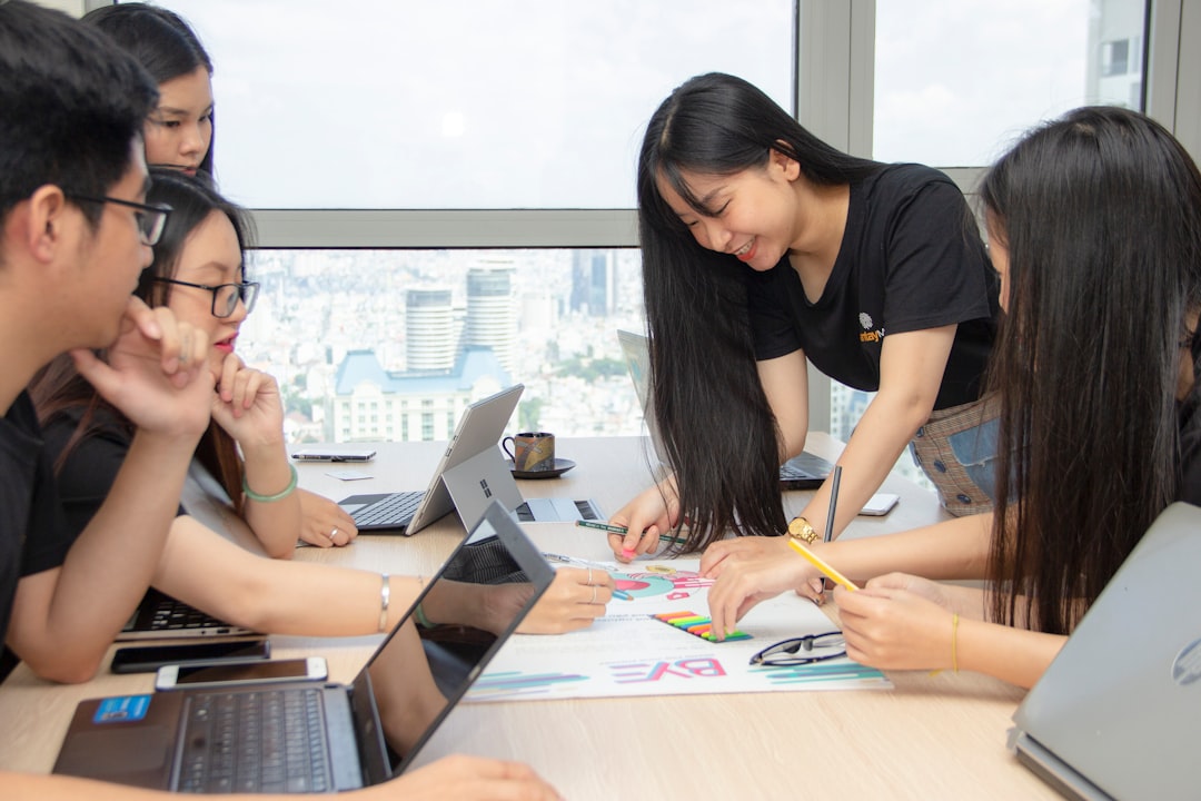 women using laptops customer support training team workshop office coaching