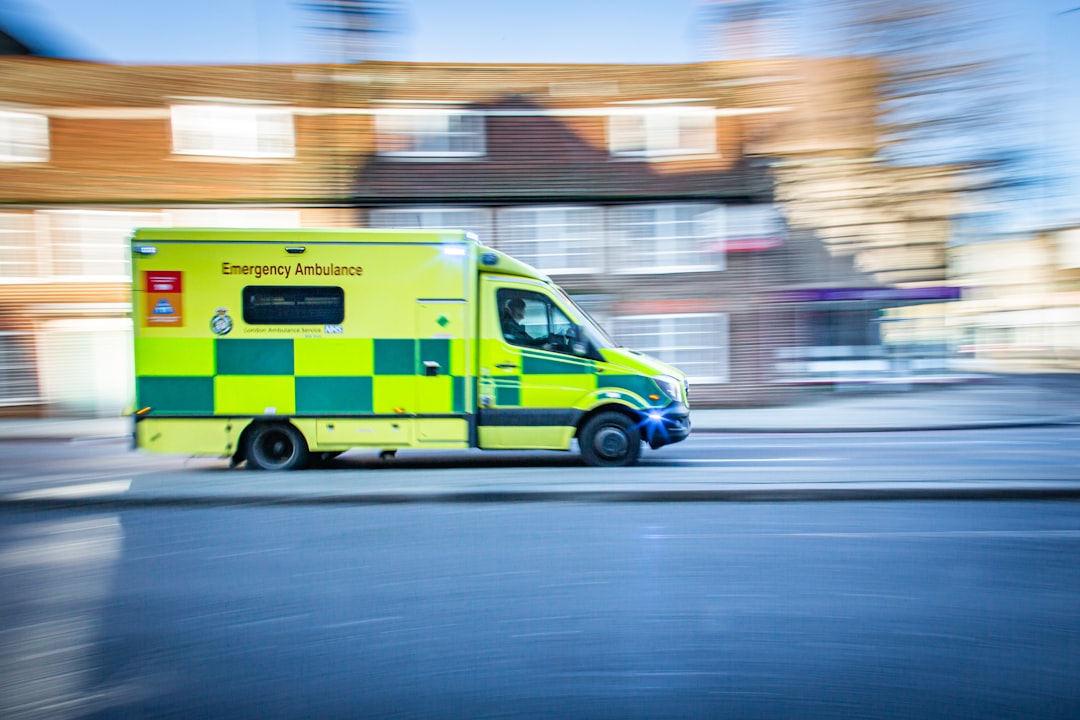 yellow and white van on road during daytime staff scheduling compliance records emergency vehicles