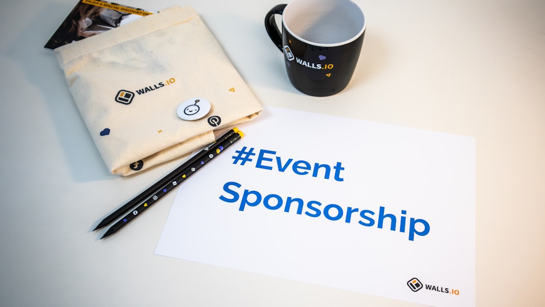 a cup of coffee next to a sign that says event sponsor newsletter sponsorship pricing media kit advertising proposal 1