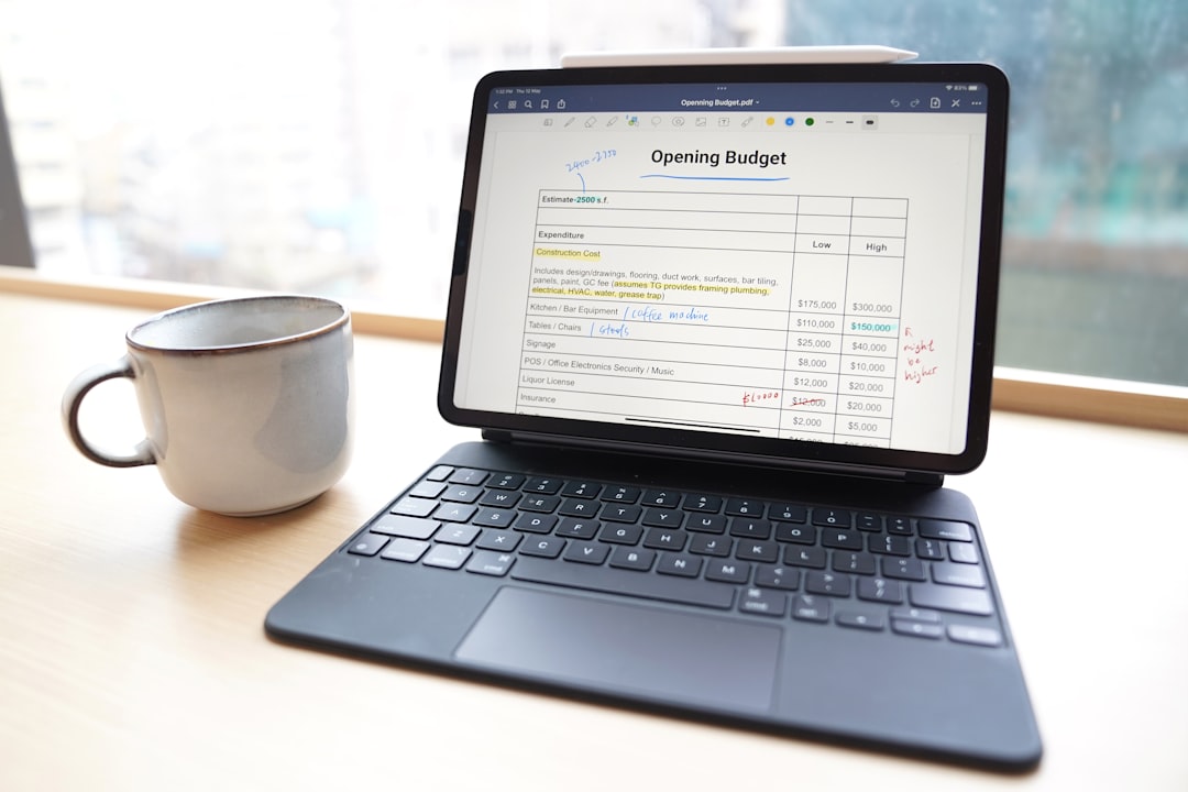 a laptop and a cup of coffee software comparison scheduling apps pricing table