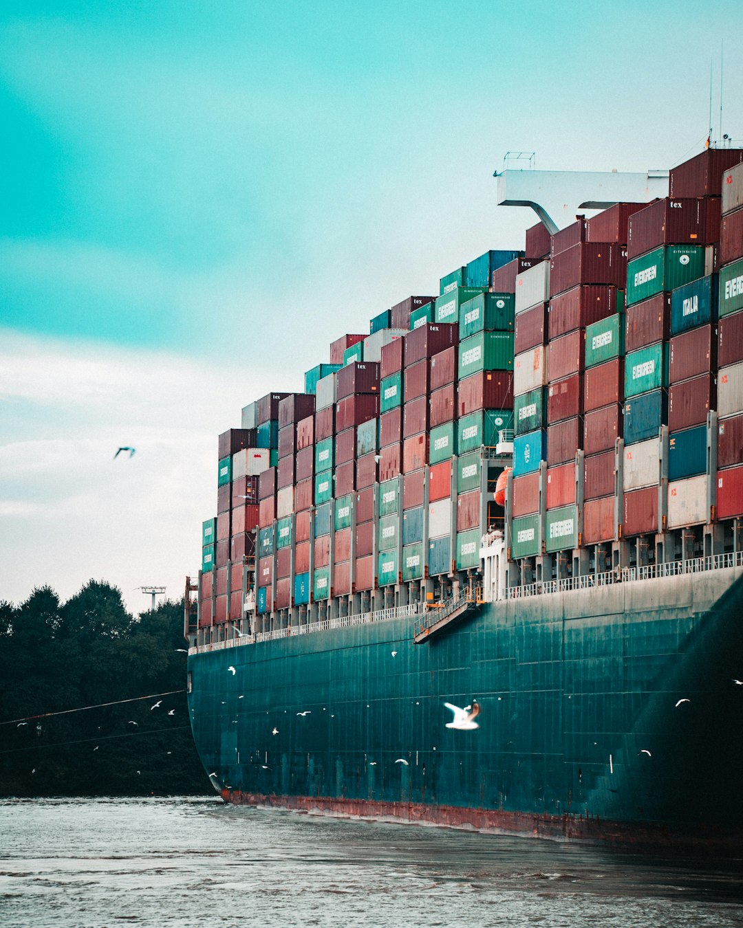 a large cargo ship loaded with lots of containers logistics competitors freight visibility platforms supply chain technology