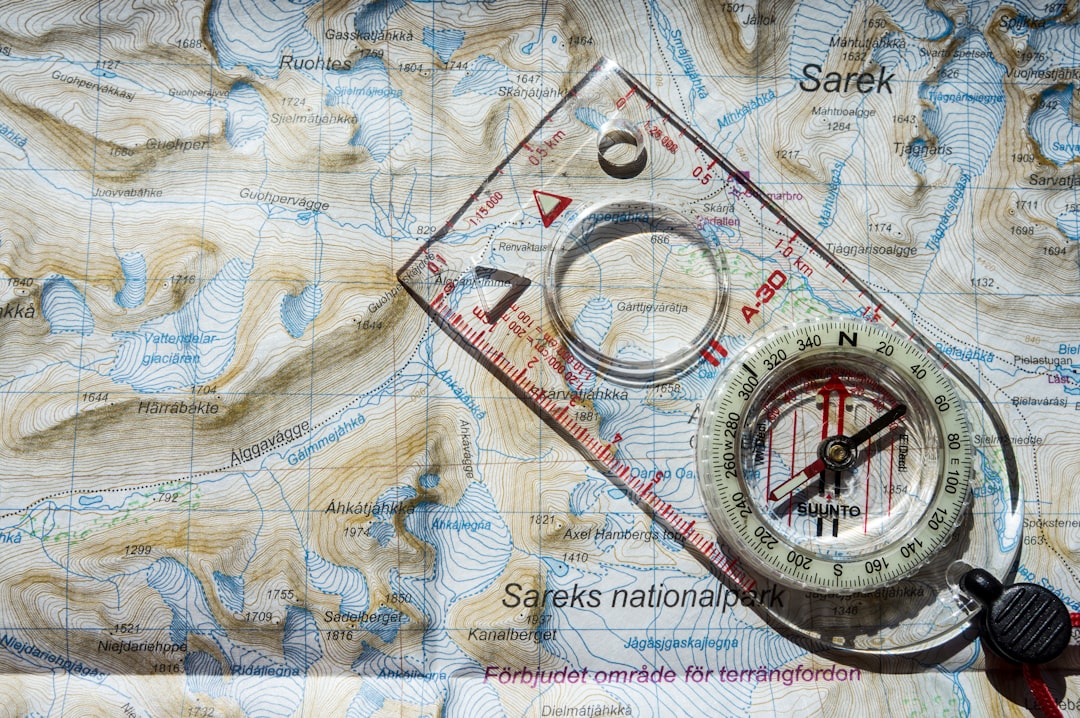 clear and white compass with ruler on map illustration topographic map compass hiking gear forest