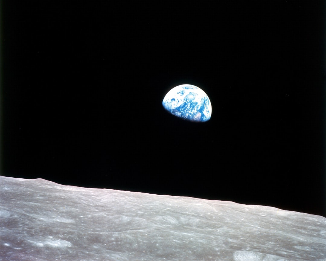 earth above the lunar surface moon landing bold vision historic achievement