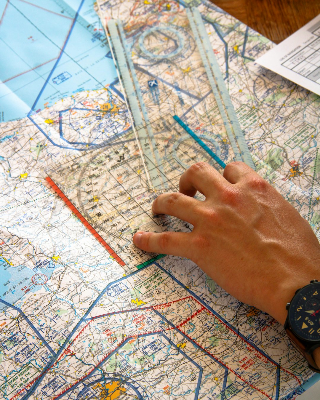 hand using ruler on aviation chart freight tracking dashboard logistics map shipment visibility