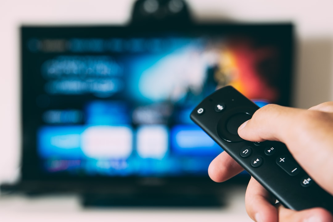 turned on flat screen television streaming interface live tv remote control