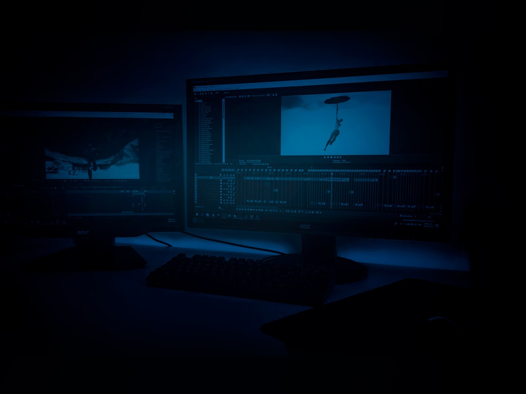 two turned on flat screen monitors technical support center monitoring screens night shift