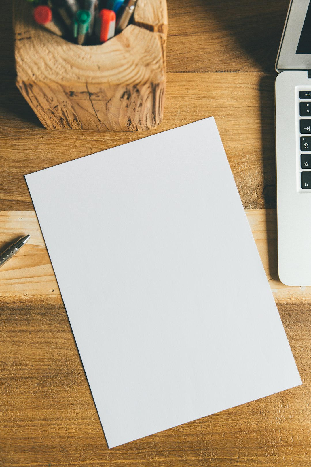 white printer paper beside black pen scanned document text recognition office desk