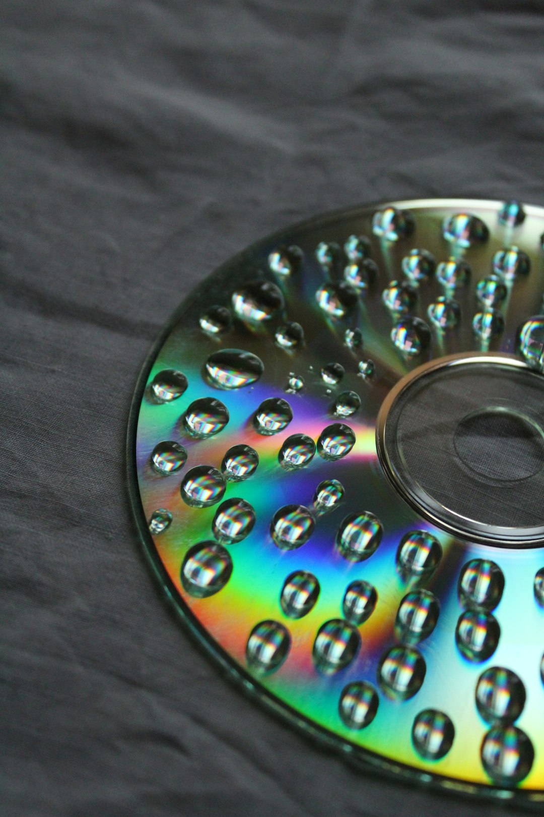 a close up of a device cd repair plastic polish hand cleaning