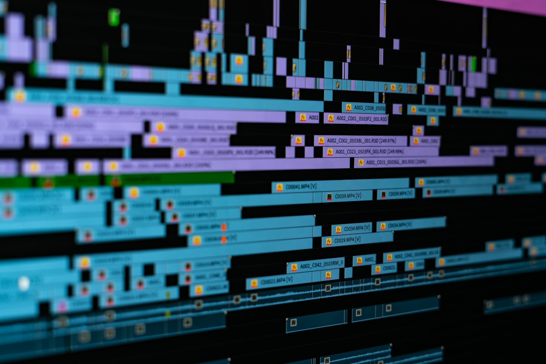 a digital video editing timeline with blue and purple clips on a black background color grading screen video editor creative project