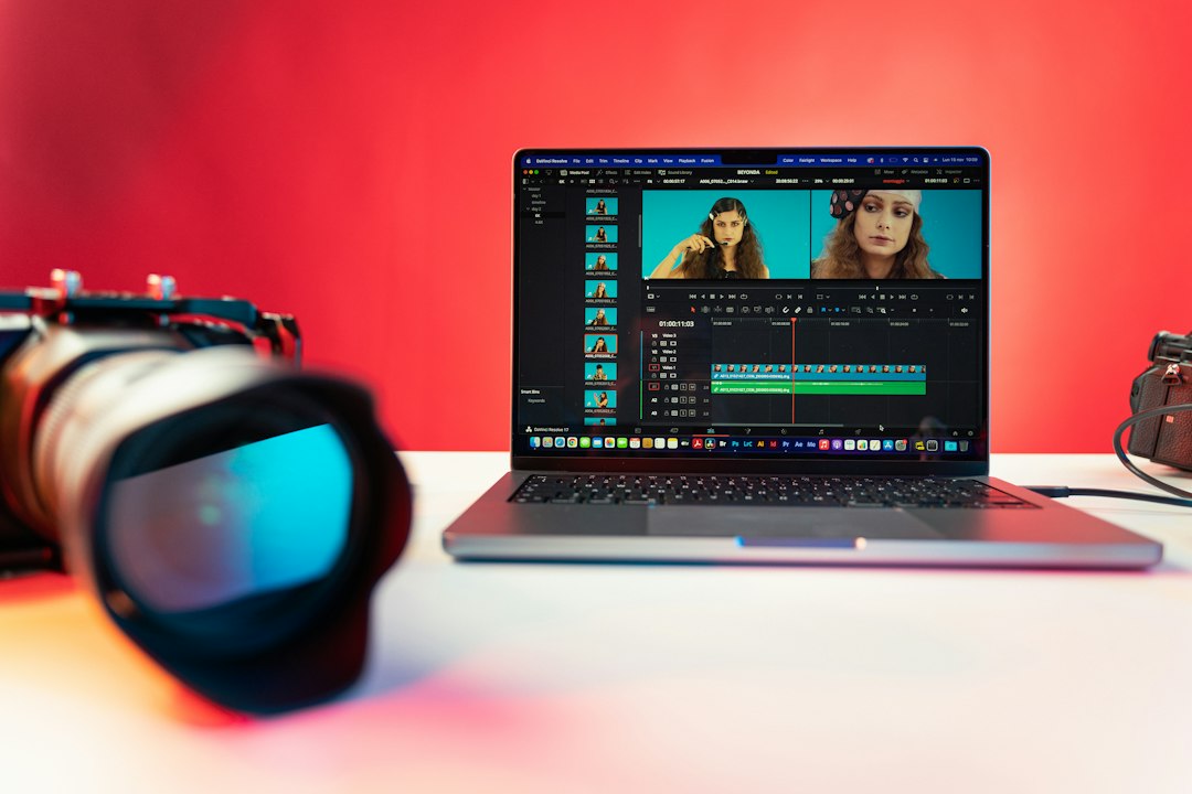 a laptop computer sitting on top of a table content creator desk laptop editing social video