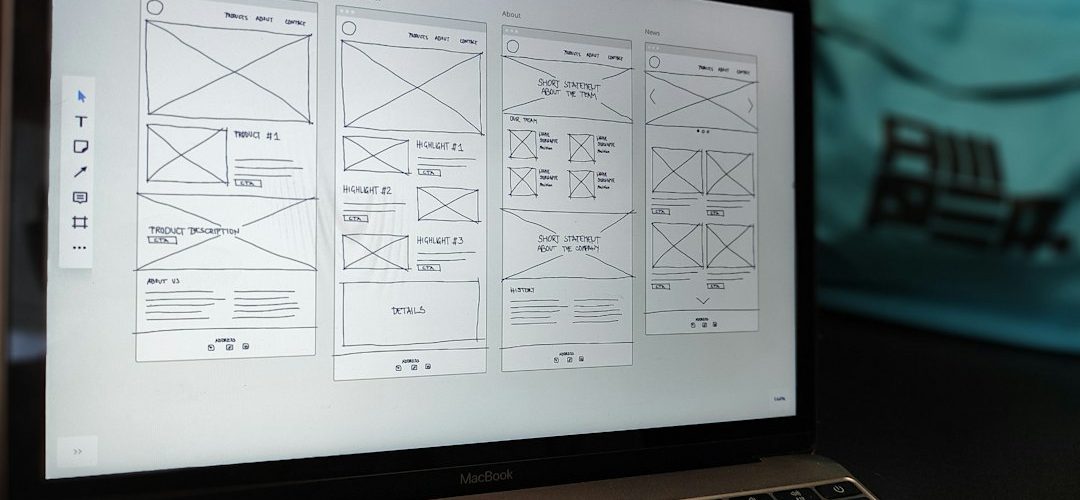 a laptop computer sitting on top of a table design system components team collaboration interface mockups