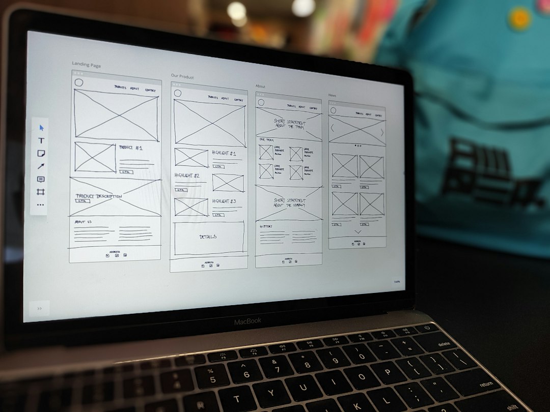 a laptop computer sitting on top of a table design system components team collaboration interface mockups