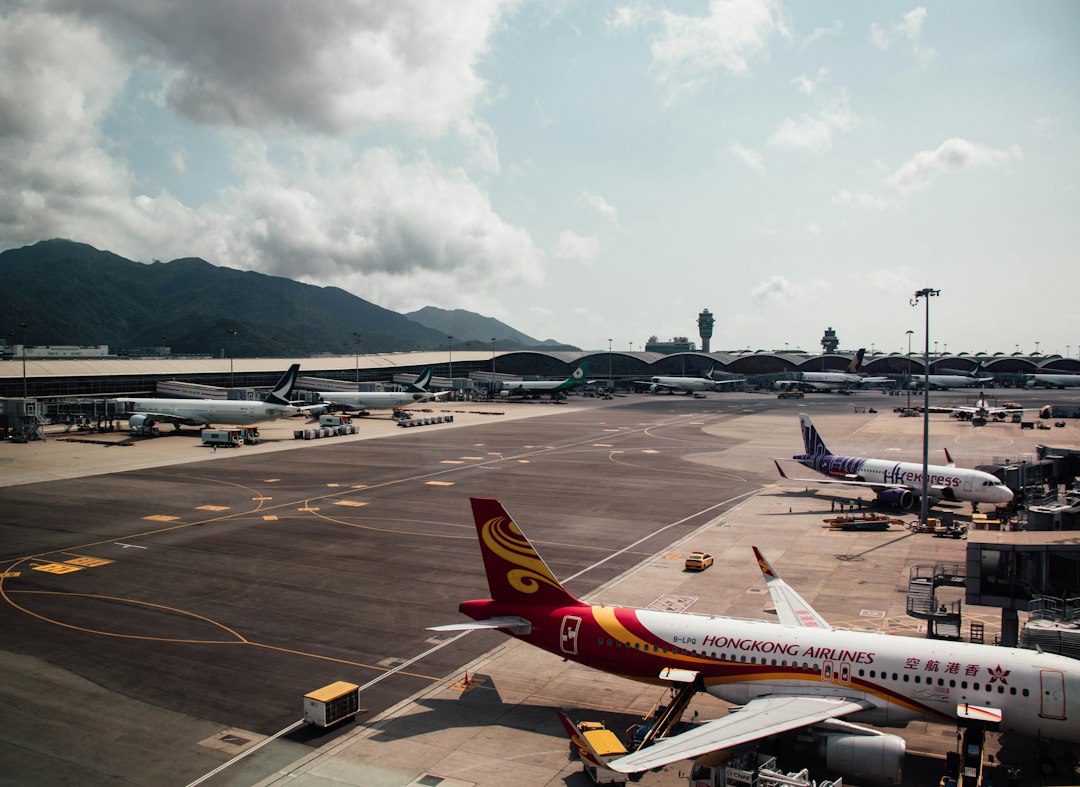 a large jetliner sitting on top of an airport tarmac airport gates mobile ticket qr code passengers