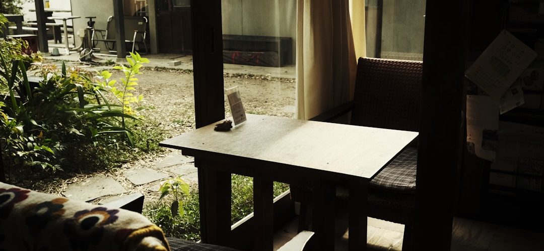 a living room with a couch and a table homestay room cozy bed morning light travel stay