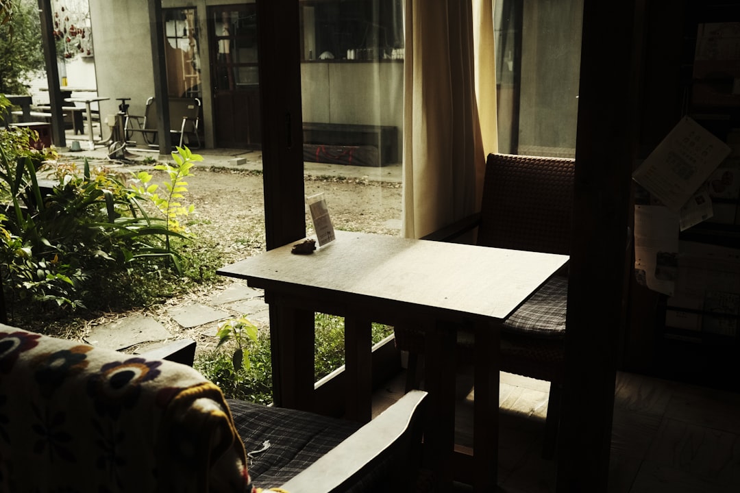 a living room with a couch and a table homestay room cozy bed morning light travel stay