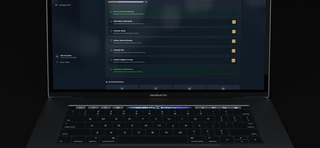 a modern laptop displaying a dark themed dashboard ai app builder comparison laptop screens prototype dashboard