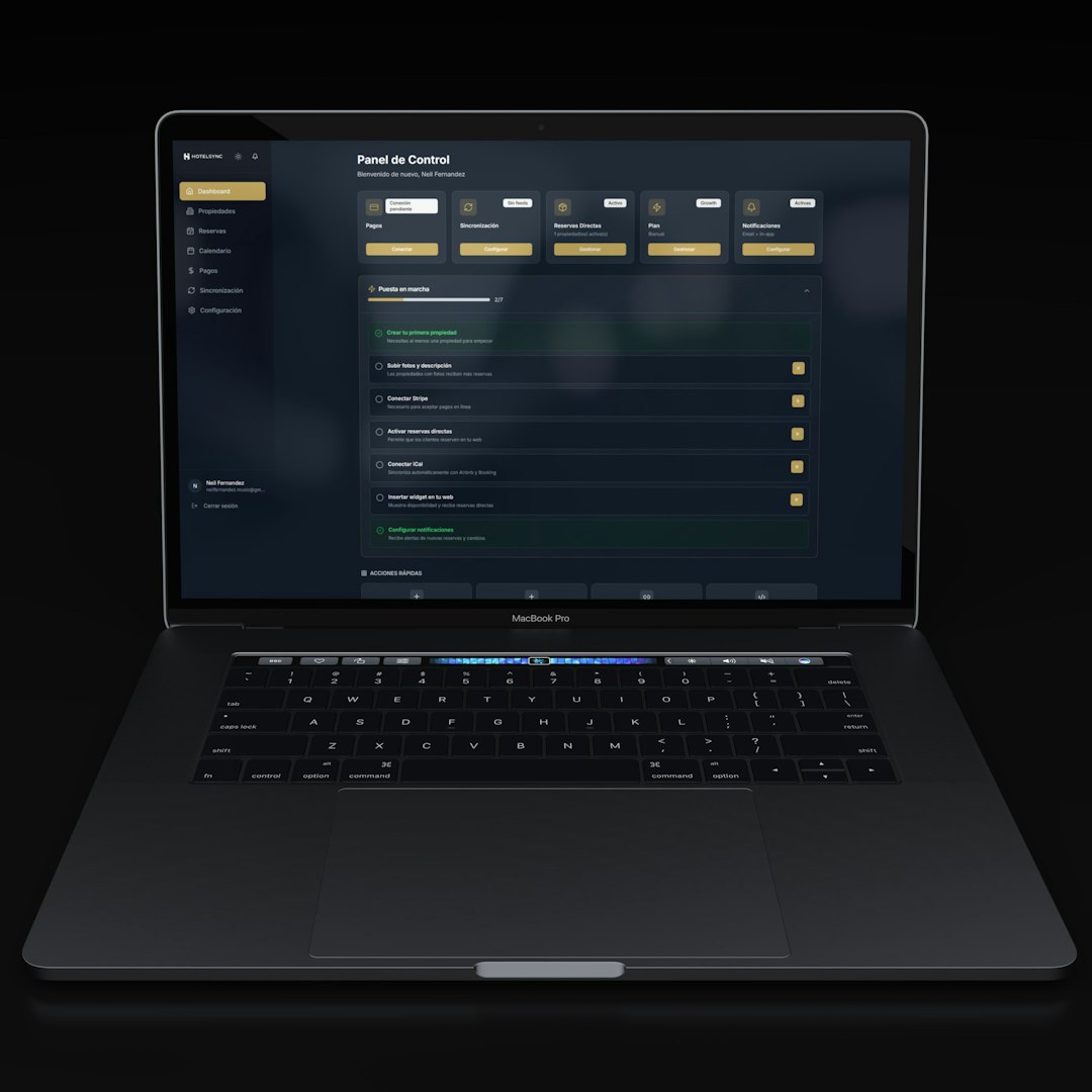 a modern laptop displaying a dark themed dashboard ai app builder comparison laptop screens prototype dashboard