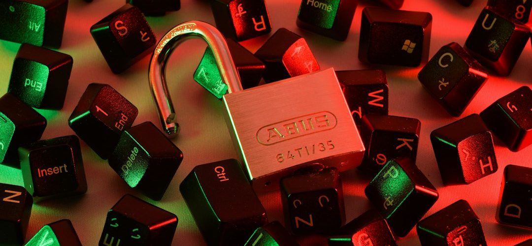 an open padlock surrounded by scattered black computer keyboard keys under red and green light vpn security encryption keys remote access