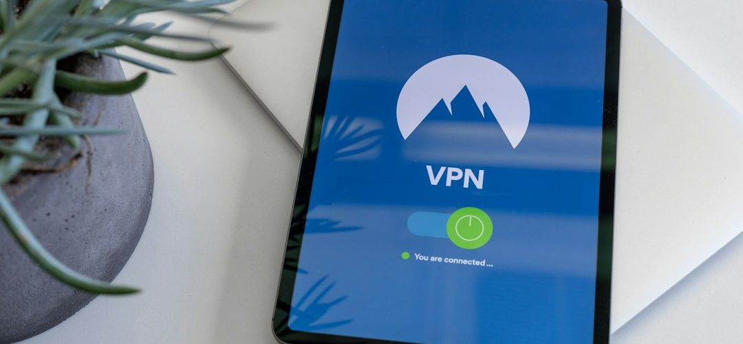 black tablet computer turned on displaying vpn vpn clients laptop phone router network access