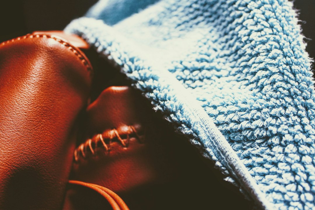 brown leather shoe with blue cloth scratched cd microfiber cloth bright light
