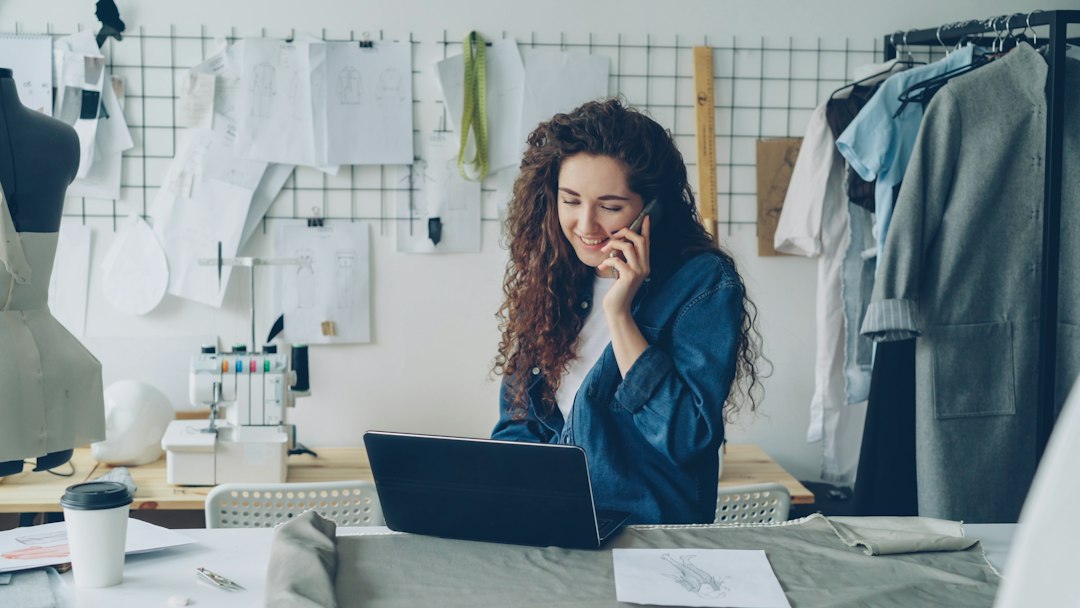 fashion designer on the phone working on a laptop small business owner email template online store