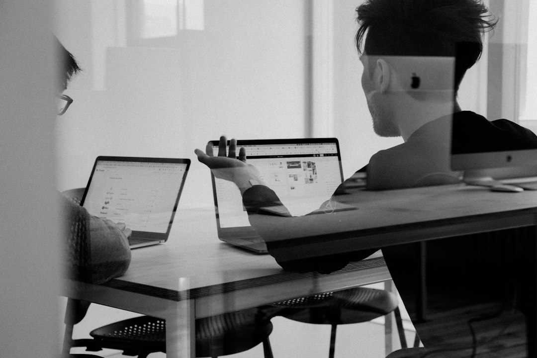 man using macbook figma interface dashboard design wireframes prototype