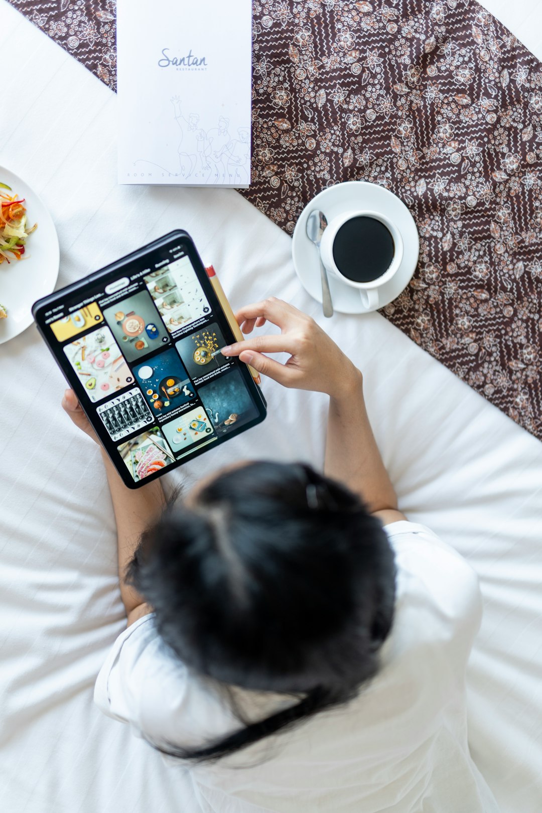 person browsing ipad hotel email dashboard guest segments booking campaign