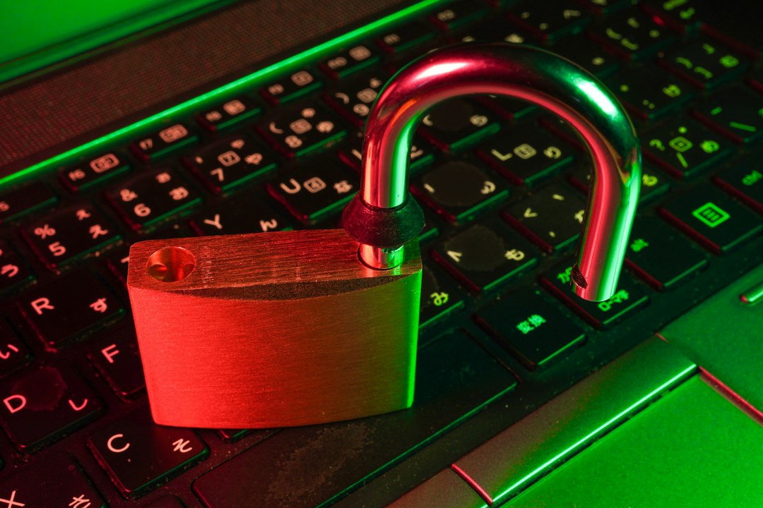 red padlock on black computer keyboard phishing email login code security warning