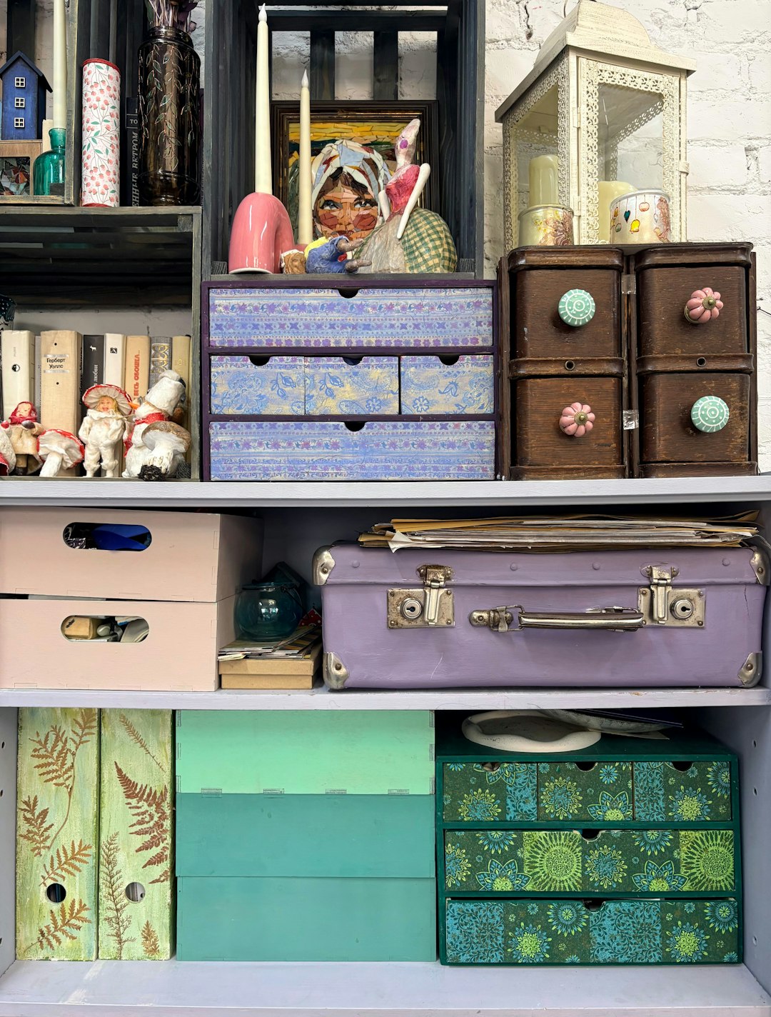 shelves filled with decorative boxes and trinkets cd storage jewel cases organized shelf