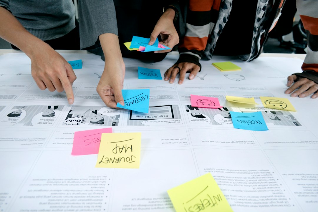 team collaborating with sticky notes ai assistant paper notes design planning product team