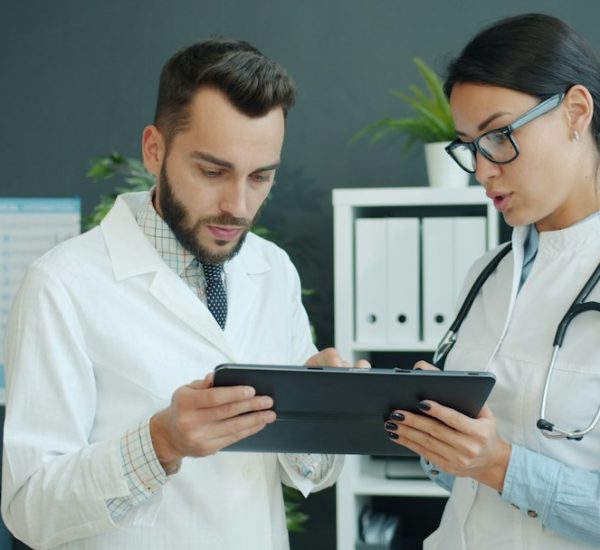 Medical Digital Marketing: WebFX vs Ignite Visibility and Other Agencies for Healthcare Marketing 8 two doctors looking at a tablet together healthcare marketing comparison agency selection medical website analytics