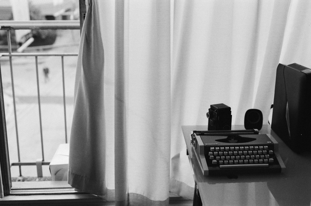 vintage typewriter and camera on a desk by window ai writing tools editing workflow concise writing