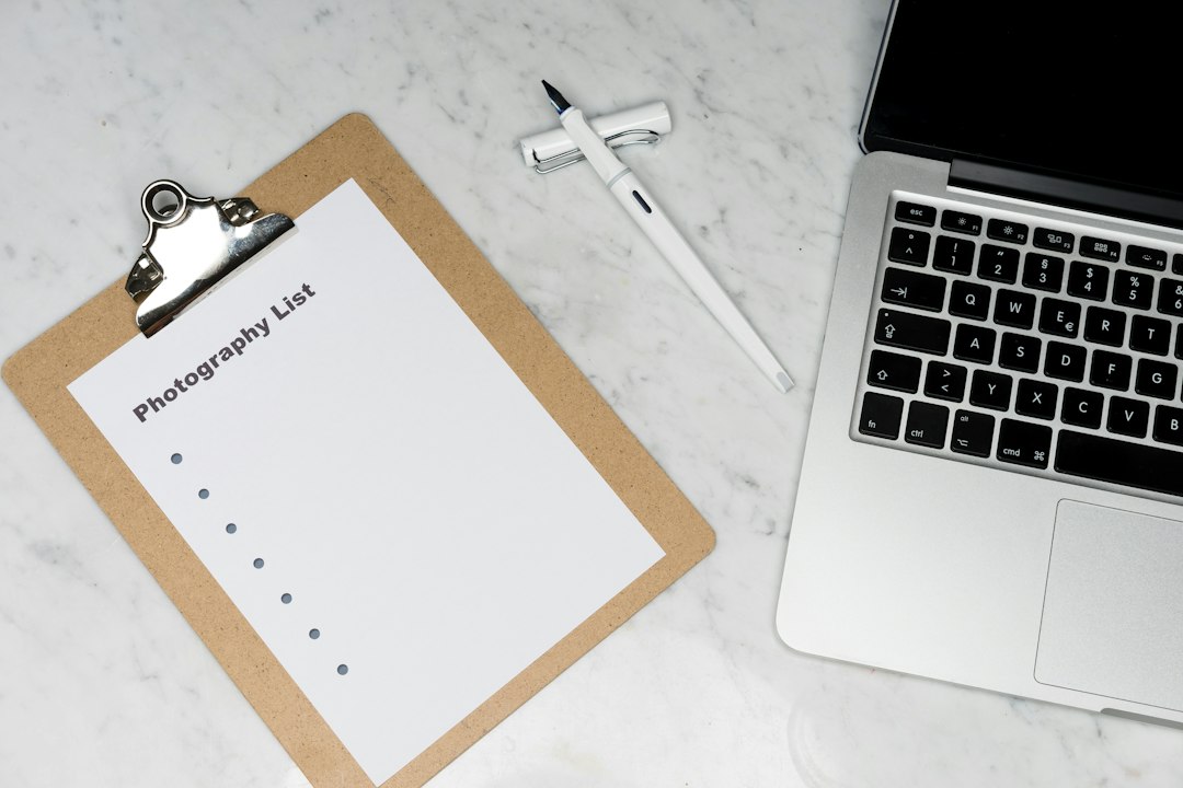 white paper on silver laptop computer editing checklist short paragraphs job search