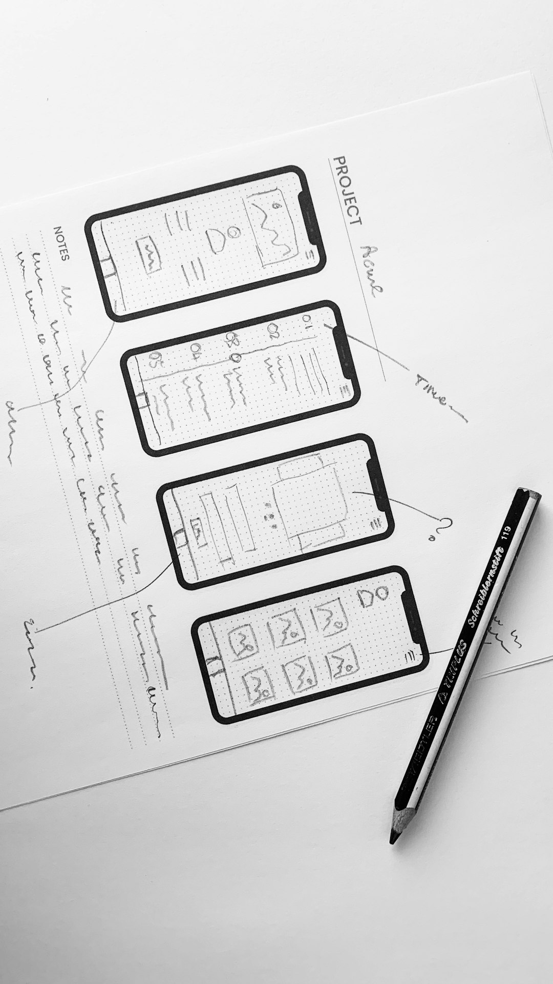 white printer paper with black pen design system components team collaboration interface mockups