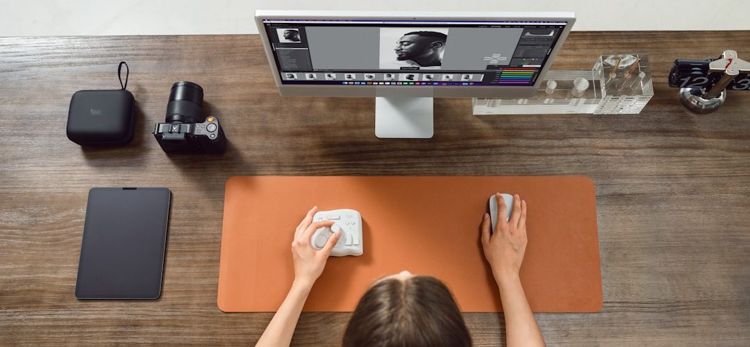 woman edits photos on a computer scratched dvd microfiber cloth cleaning table